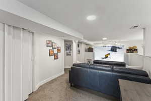 Bedroom featuring carpet floors and rail lighting