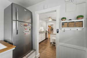 Kitchen featuring ceiling fan, white cabinetry, sink, and appliances with stainless steel finishes