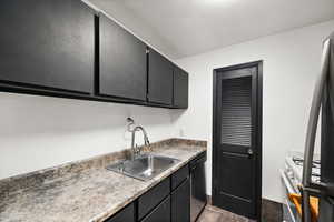 Kitchen featuring sink, dishwasher, and range with gas cooktop