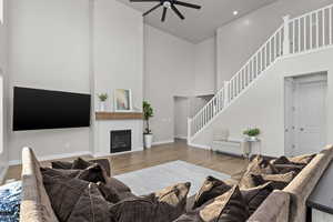 Great room featuring towering ceilings and a gas fireplace