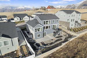 Birds eye view of property with mountain views