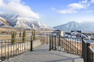 Deck off of dining area featuring mountain views