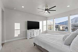 Primary bedroom on main level featuring mountain views