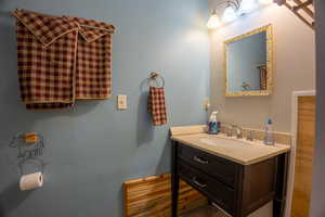 Half Bathroom with view to owner's lock-out cabinet/closet