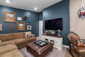 Living room featuring light carpet