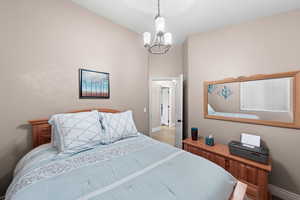 Bedroom featuring a chandelier