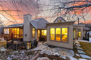 Back house at dusk with a walkout basement