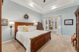 Master bedroom with tiered ceiling ensuite bathroom and walk-in closet