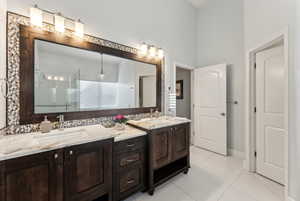 Master bathroom featuring double vanity and private toilet