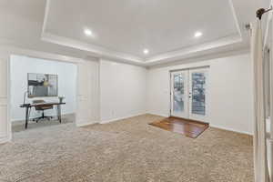 Walkout basement featuring french doors and office nook