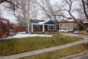 View of front of property featuring a yard