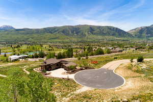 Property view of mountains featuring a water view