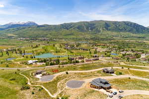 Bird's eye view featuring a water and mountain view