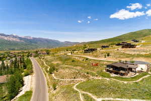 Birds eye view of property with a rural view and a mountain view