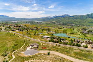 Drone / aerial view with a water and mountain view