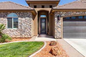 Entrance to property with a garage