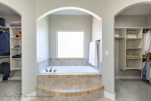 Bathroom with tiled bath