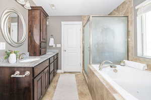 Bathroom with plus walk in shower and vanity