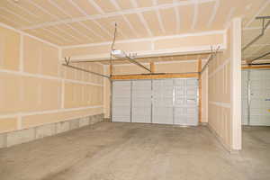 Garage featuring a garage door opener