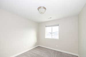 View of carpeted spare room