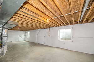 Basement featuring a healthy amount of sunlight