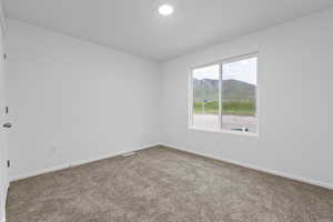 Carpeted spare room with a mountain view