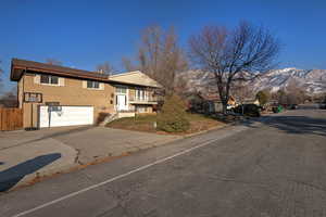 Exterior space featuring a garage and a mountain view