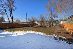 View of yard covered in snow