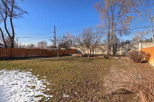 View of yard covered in snow