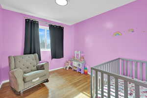 Bedroom featuring hardwood