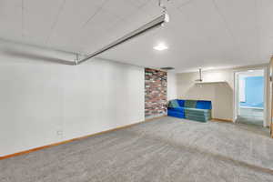 Basement featuring new carpet floors