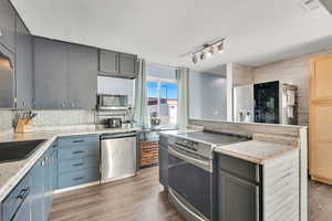 Kitchen with stainless steel appliances and island