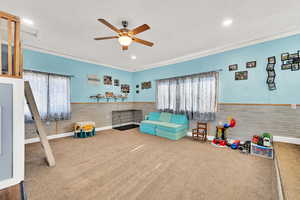 Game room featuring ceiling fan, and carpet