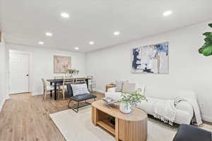 Living room with light wood-type flooring