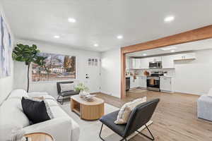 Living room with light hardwood / wood-style floors