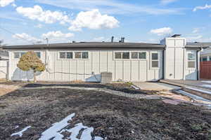 Rear view of property with central AC and a patio area