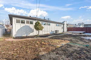 Back of property featuring central AC unit