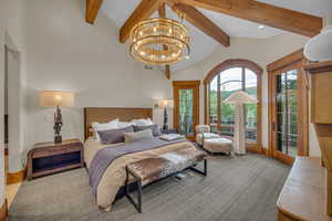 Bedroom featuring access to outside, a chandelier, and carpet floors