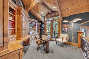 Carpeted office space featuring french doors, recessed lighting, wooden ceiling, and built in features