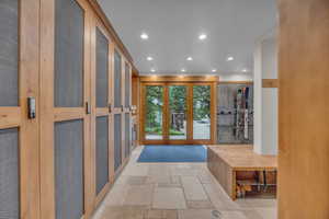 Foyer featuring stone tile flooring, recessed lighting, and a heating unit