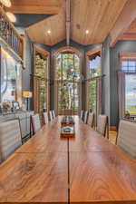 Dining space with wooden ceiling, plenty of natural light, and recessed lighting