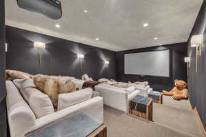 Cinema with recessed lighting and carpet floors