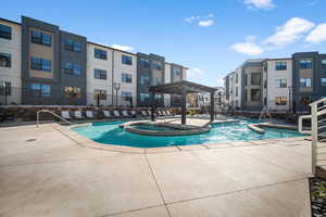 View of swimming pool with a patio and a pergola