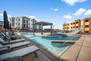 View of pool featuring a patio and a pergola