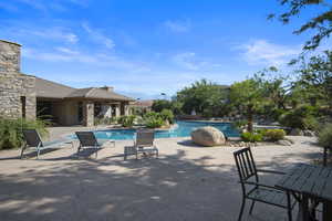 View of swimming pool with a patio