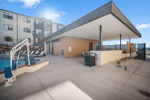 View of swimming pool with a patio area