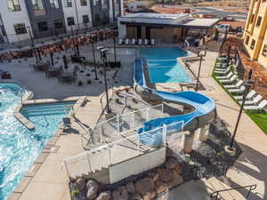 View of pool featuring a patio and a water slide