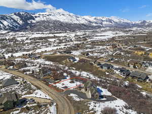 Snowy aerial view featuring a mountain view