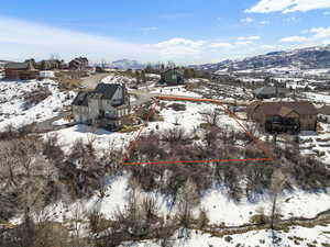 Snowy aerial view with a mountain view