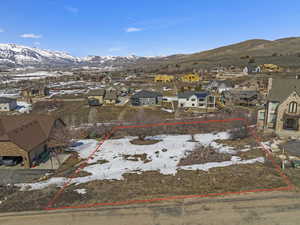 Snowy aerial view featuring a mountain view